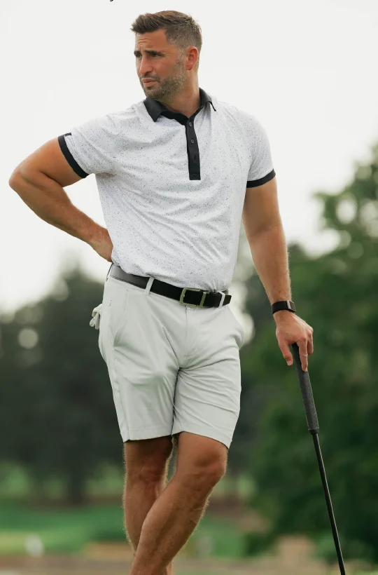 Golfer in Castle Golf Co. polo on course