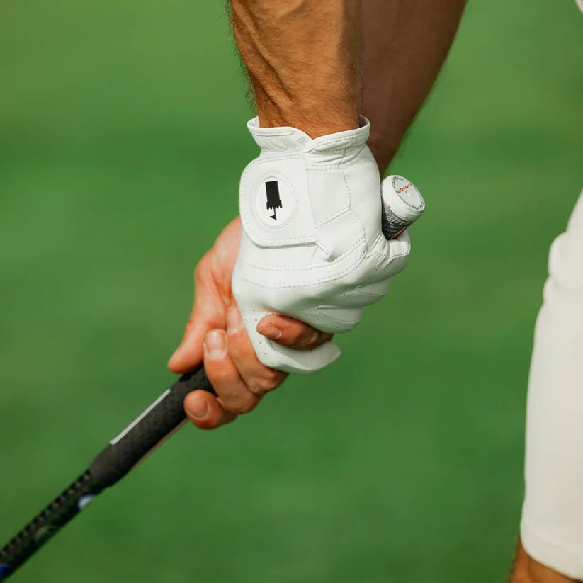 Castle Golf Co. glove gripping a club